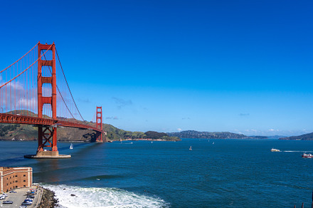 Golden Gate Bridge over blue waters with scenic hills in San Fra, an Architecture Photo by GoodGoods