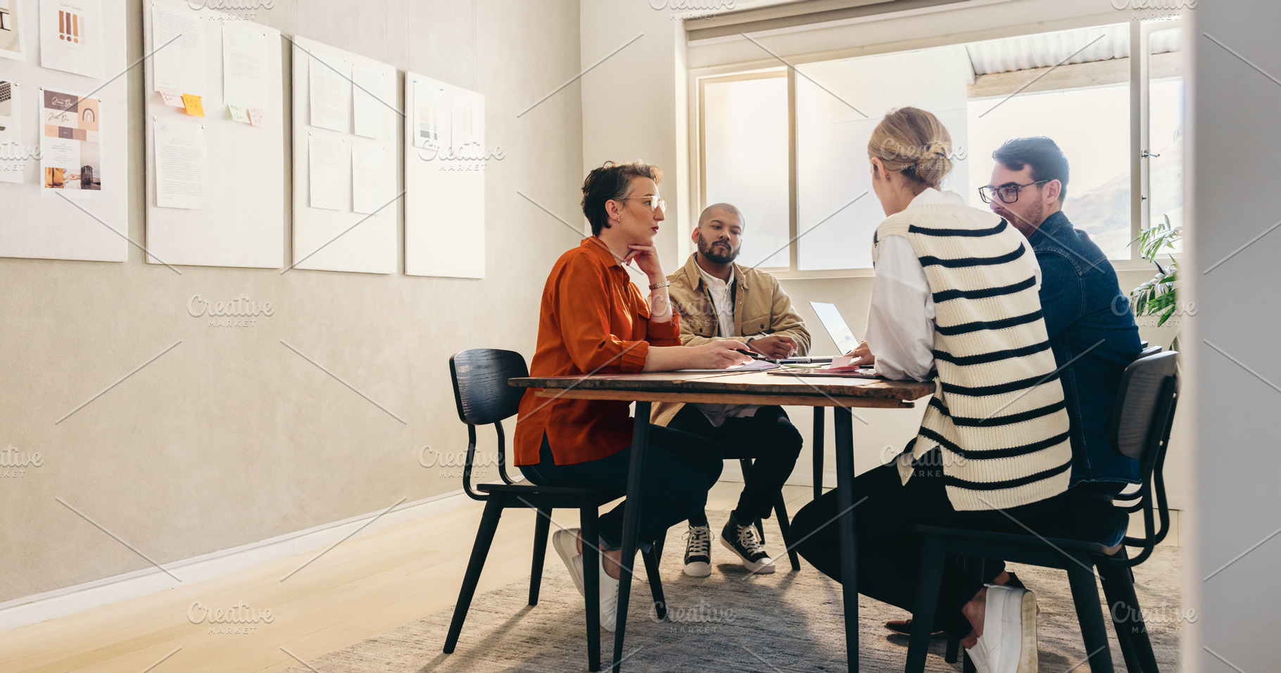 Group of creative businesspeople brainstorming in an office, a Person Photo by Jacob Lund