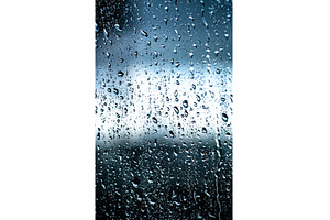 Rain on Window Pane Capturing Nature, a Background Photo by Our Amazing World
