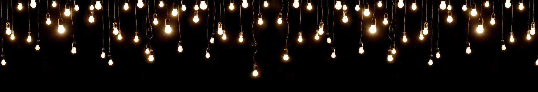 Light bulbs over dark texture, a Holiday Photo by 5max