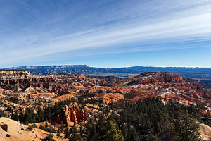 Utah canyon landscape of red rock formations with trees under a blue sky and di, a Nature Photo by AS photostudio