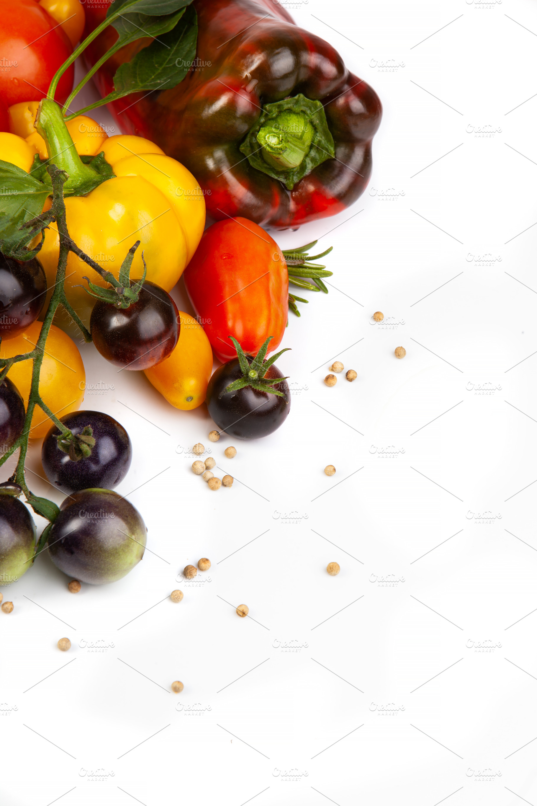 Assorted tomatoes and vegetables isolated on white background. P, a Nature Photo by eleana