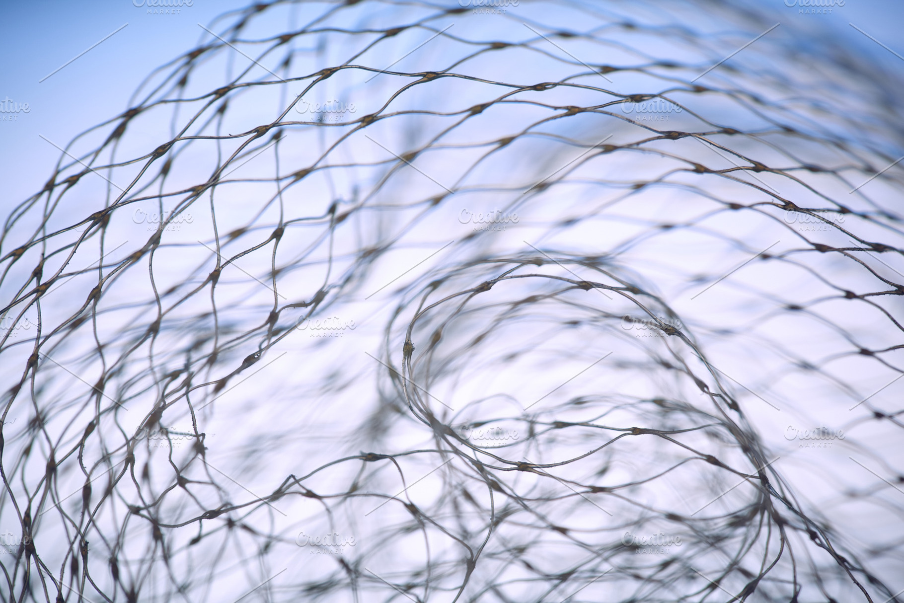Macro abstract of a white nylon net against a soft blue sky. Intricate pattern, an Abstract Photo by Rohan Photography