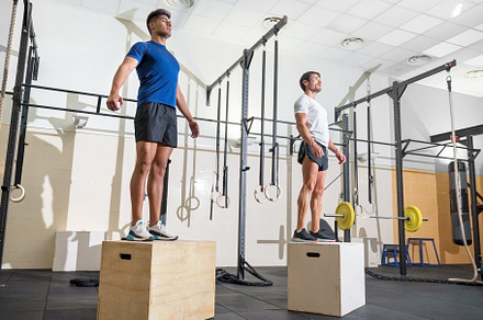 Two man jumping on fit box at gym., a Sports & Recreation Photo by david.herraez.calzad