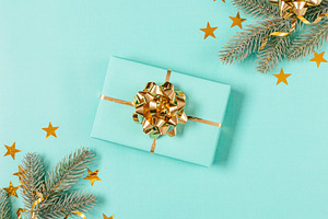 Blue Christmas gift box with gold bo