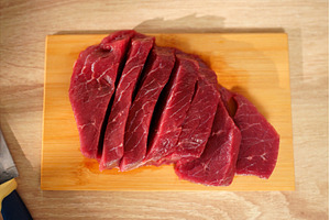 Freshly sliced red meat displayed on, a Food & Drink Photo by darksoul72