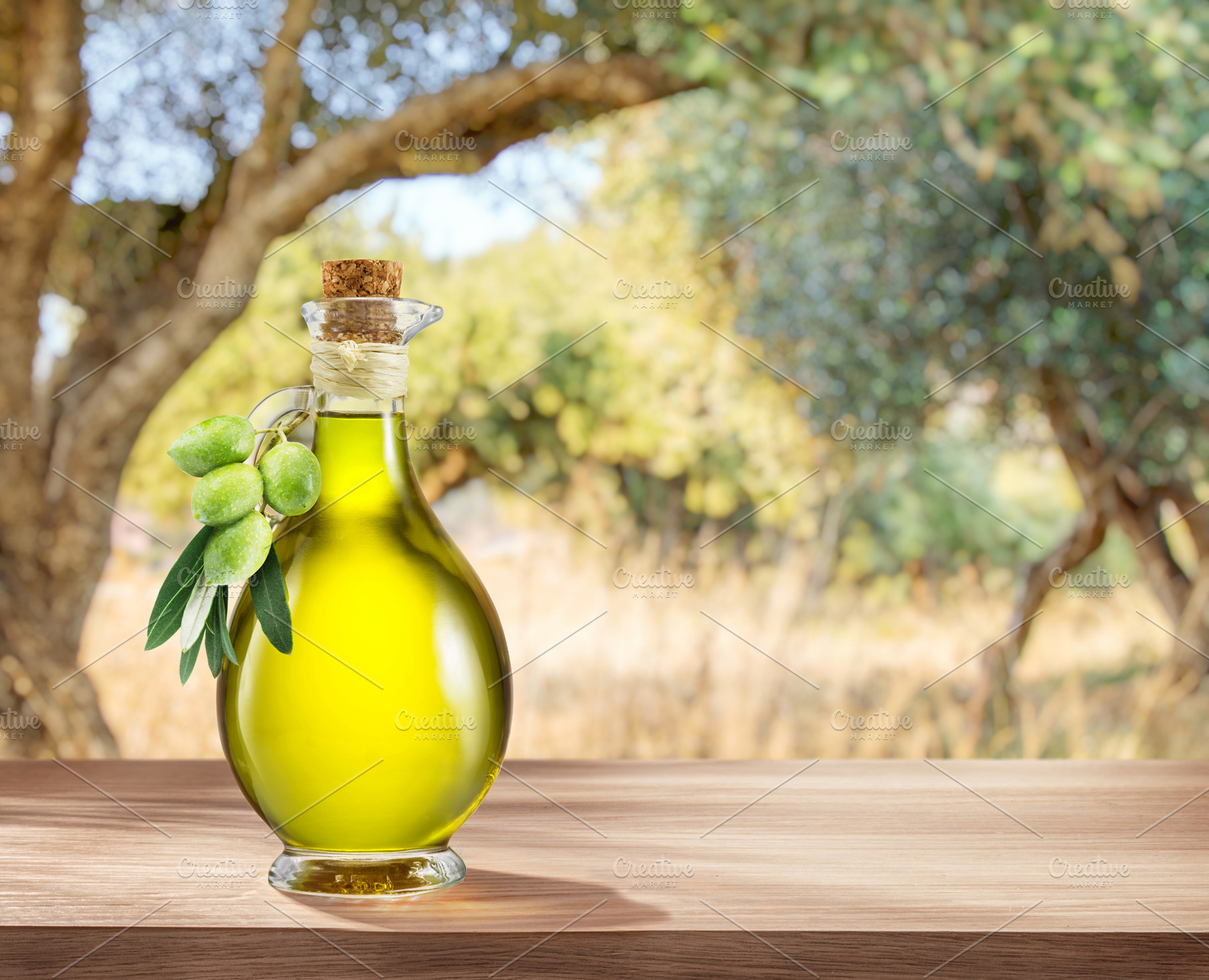 Bottle of craft farm olive oil stands on a wooden table., a Food & Drink Photo by Volff