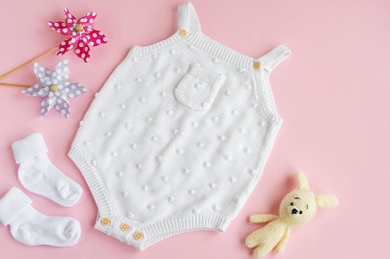 Set of white clothes and accessories for newborn baby. Knitted t, a Beauty & Fashion Photo by Olena Rudo