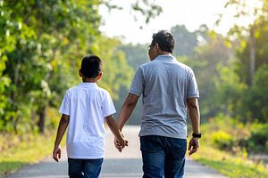 Father and his son walking in a natural outdoor setting, a Person Photo by DanFLCreativo