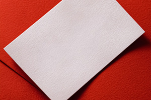 Blank white textured card mockup on a vibrant red background, pe, a Photo by Studio ANNA