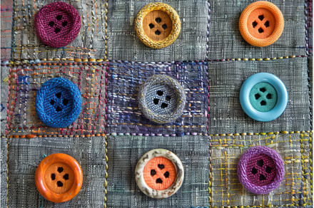 Colorful buttons adorning a, an Arts & Entertainment Photo by Ylivdesign