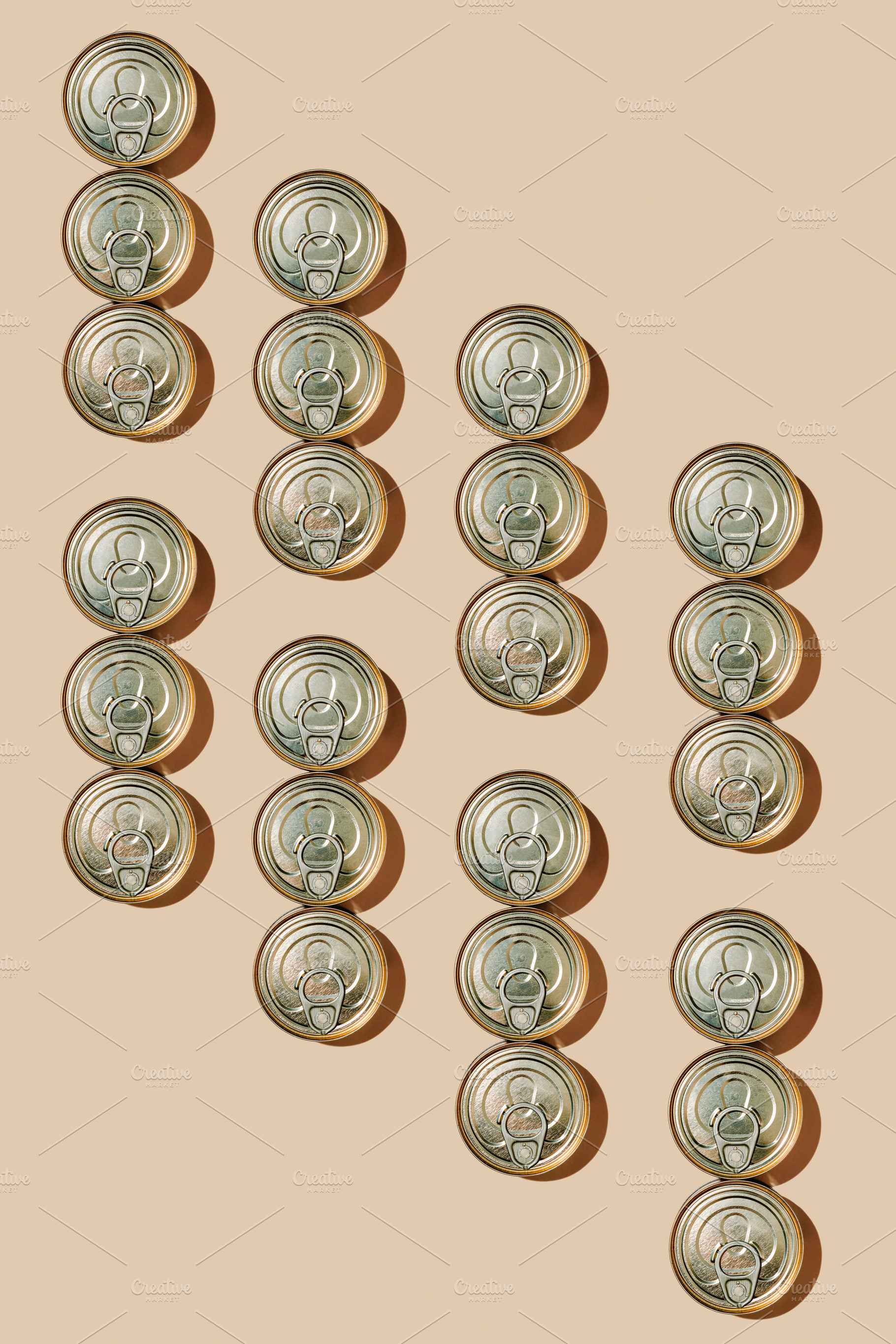 clusters of food cans on a beige background, a Photo by Nito