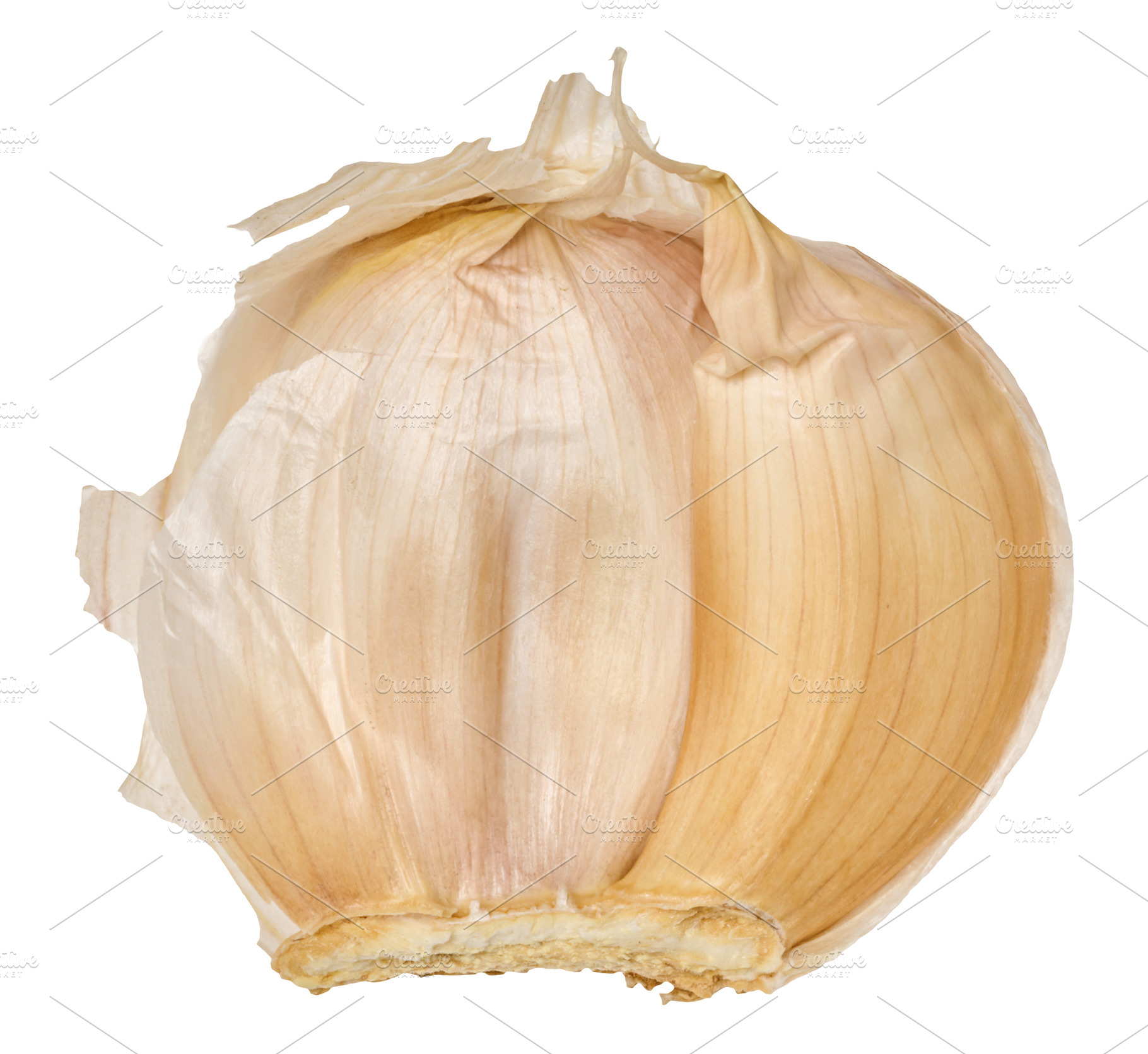 A clove of garlic in a dry beige peel, isolated on a background., a Food & Drink Photo by ndanko