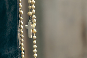 White rosary with cross hanging, faith and spirituality concept, a Holiday Photo by Antonio Gravante Market