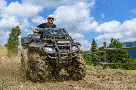 ATV racing on dirt track at summer mountain, a Transportation Photo by Byrdyak