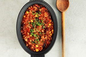 Mexican Chili with Corn Chips and Wooden Spoon on Light Backgrou, a Food & Drink Photo by Natalia Klenova's Shop