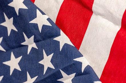 part of the American flag with stars and red and white stripes, a Photo by MyPhotos