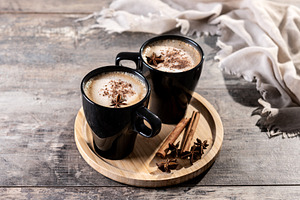 Chai Latte in Black Mug with Spices( star anise and cinnamon) on, a Food & Drink Photo by etorres69
