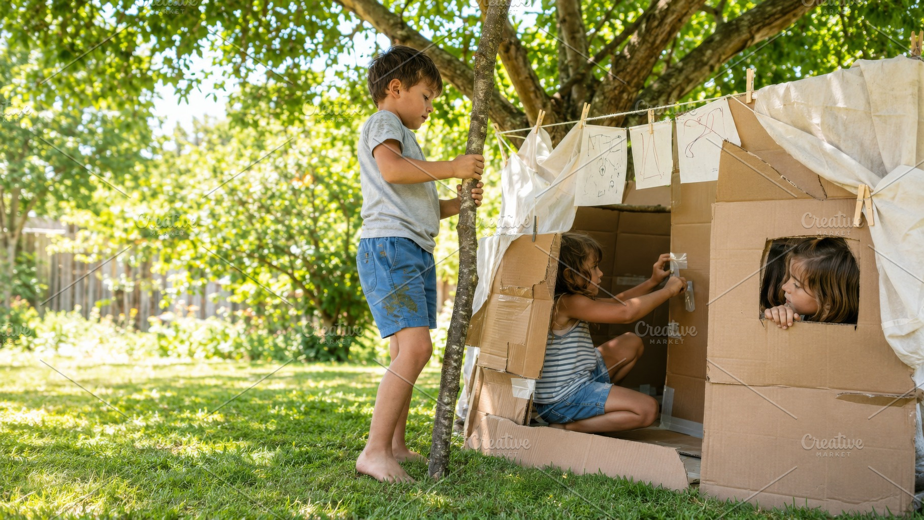 Children playing outdoors with cardb, a Photo by Dvoevnore photos