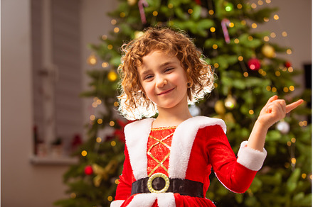 Adorable girl in Christmas dress, a Holiday Photo by oksix