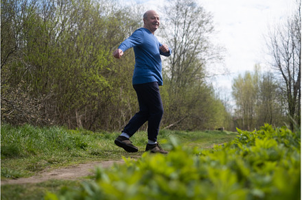 Active senior man is jogging in park, a Sports & Recreation Photo by Koldunova