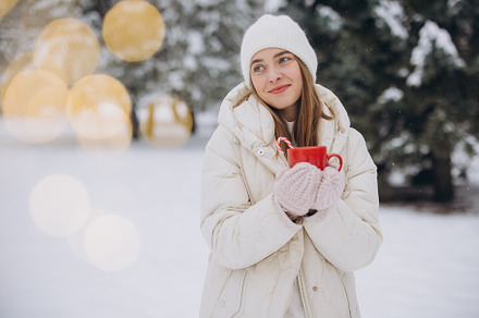 Cute happy woman holding hot coffee, a Holiday Photo by Cherkas Photography