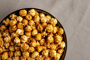 Homemade Caramel Pop Corn in a Bowl, top view. Copy space.