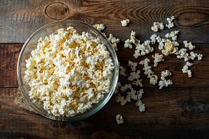 Pop corn on wood color background.Food and snack concepts ideas.Minimal style t, a Food & Drink Photo by Budarinphoto