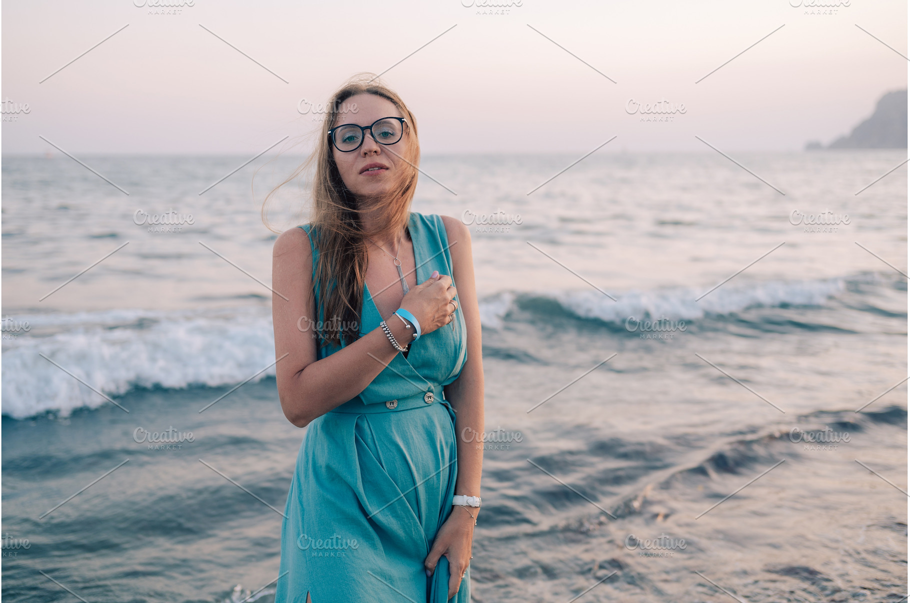 Woman in Flowing Dress on Seaside, a Person Photo by Jan Jack Russo Media