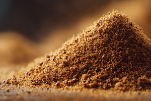 Brown spice powder on wooden surface, a Photo by Beautiful things