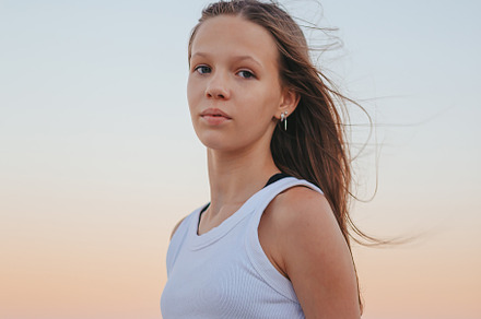 Portrait of happy girl on the beach, a Person Photo by travnikovstudio