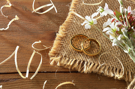 Two rings on sackcloth with bouquet on wooden table, a Holiday Photo by Davizro's Market