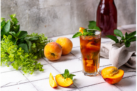 Cold ice tea with peach and mint, a Food & Drink Photo by Yulia Furman