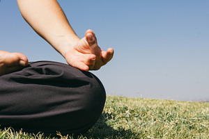 Hand of a woman doing yoga outdoors containing hand, woman, and women