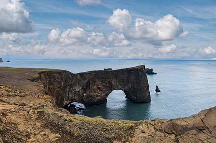 Picturesque autumn evening view to Dyrholaey coast cliffs and ro, a Nature Photo by YuriyB