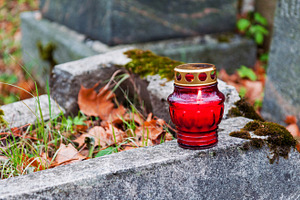 Burning cemetery candle, a Holiday Photo by BOOCYS