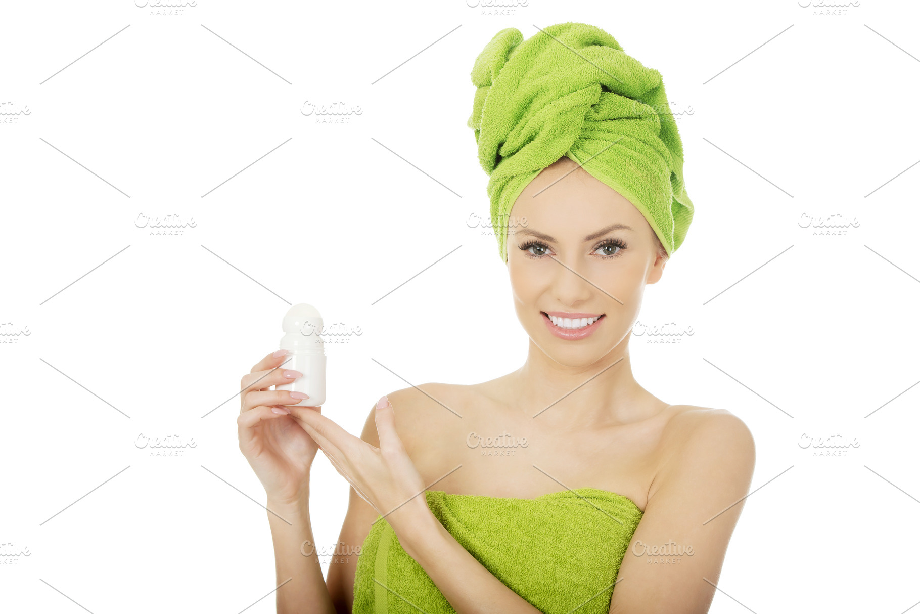 Young woman holding deodorant., a Person Photo by PhotoMediaGroup