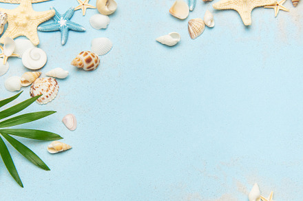 Beach accessories creating a summer holiday background on light