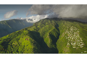Lush tropical island houses nestled, a Nature Photo by Goinyk