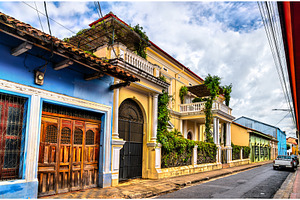 Colorful colonial homes along a, an Architecture Photo by Leonid Andronov