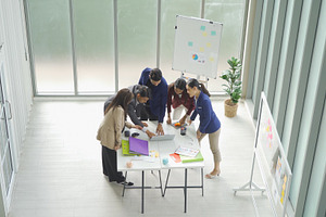 A group of Asian business team talk, communicate, discuss, and w