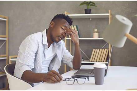 Tired man suffering from computer, a Business Photo by StudioRomantic