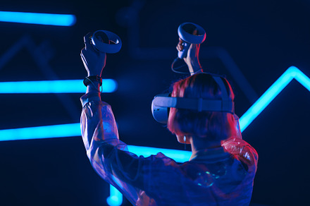 Young woman playing VR game in neon room., a Person Photo by Rov.7