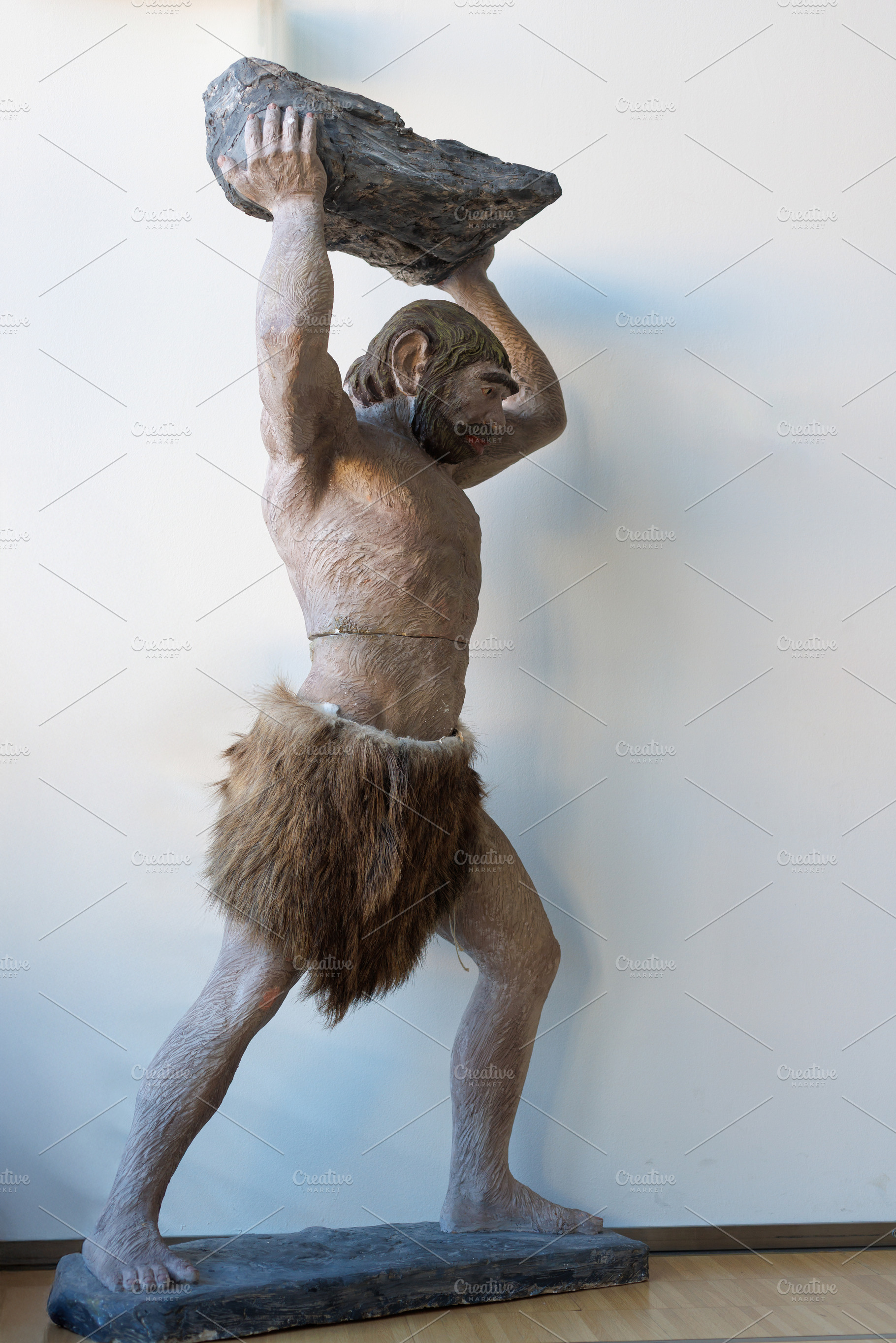 A realistic depiction of a primitive man, a School & Education Photo by Bepslabor