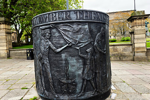 Bronze Hillsborough remembrance sculpture panel showing figures, a Photo by AS photostudio