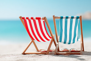 Two colorful striped deck chairs on, a Nature Photo by MistyDay
