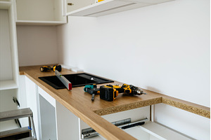 Installing kitchen countertop and, an Architecture Photo by HalfPoint