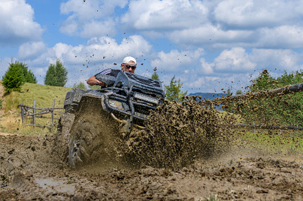 ATV racing on dirt track at summer mountain, a Transportation Photo by Byrdyak