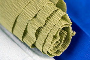 colored crumpled corrugated paper for handmade closeup, side view, a Photo by rsoollAI