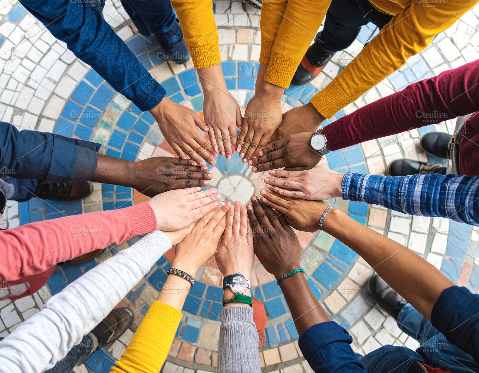 Hands assembling a mosaic of interlocking puzzle pieces, a Person Photo by DanFLCreativo